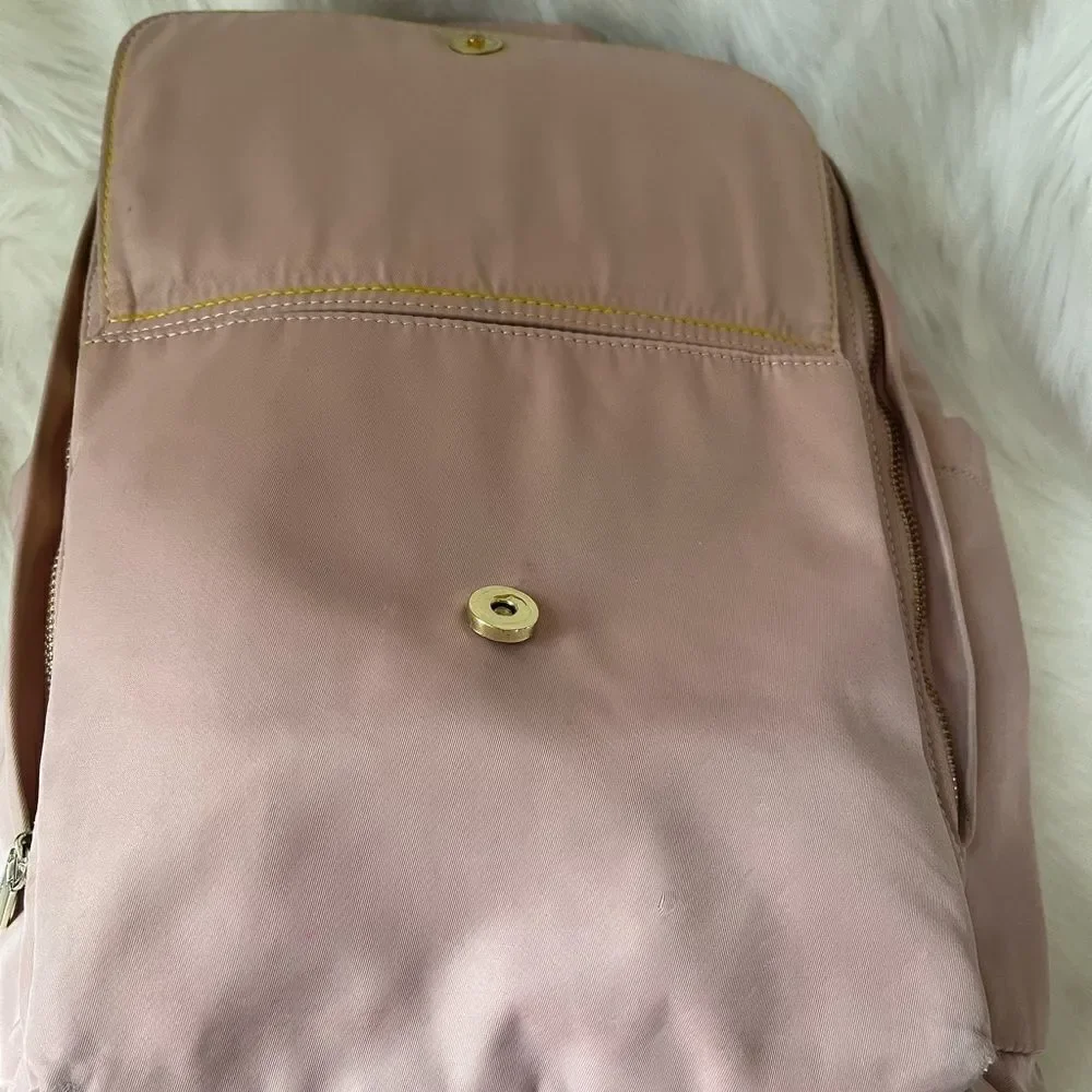 Steve Madden Nylon blush pink backpack with black embroidery back straps.